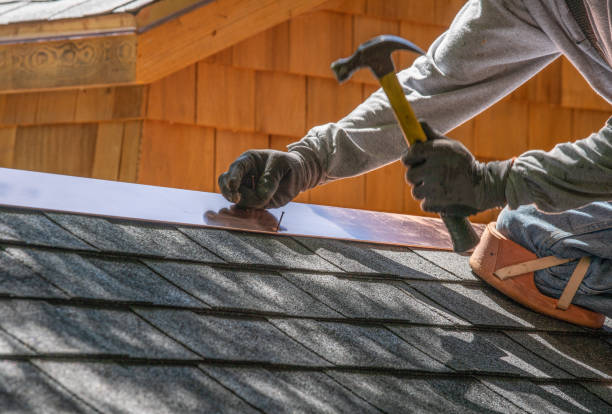 Installing new roof with  nail gun and shingles Installing new roof with  nail gun and shingles